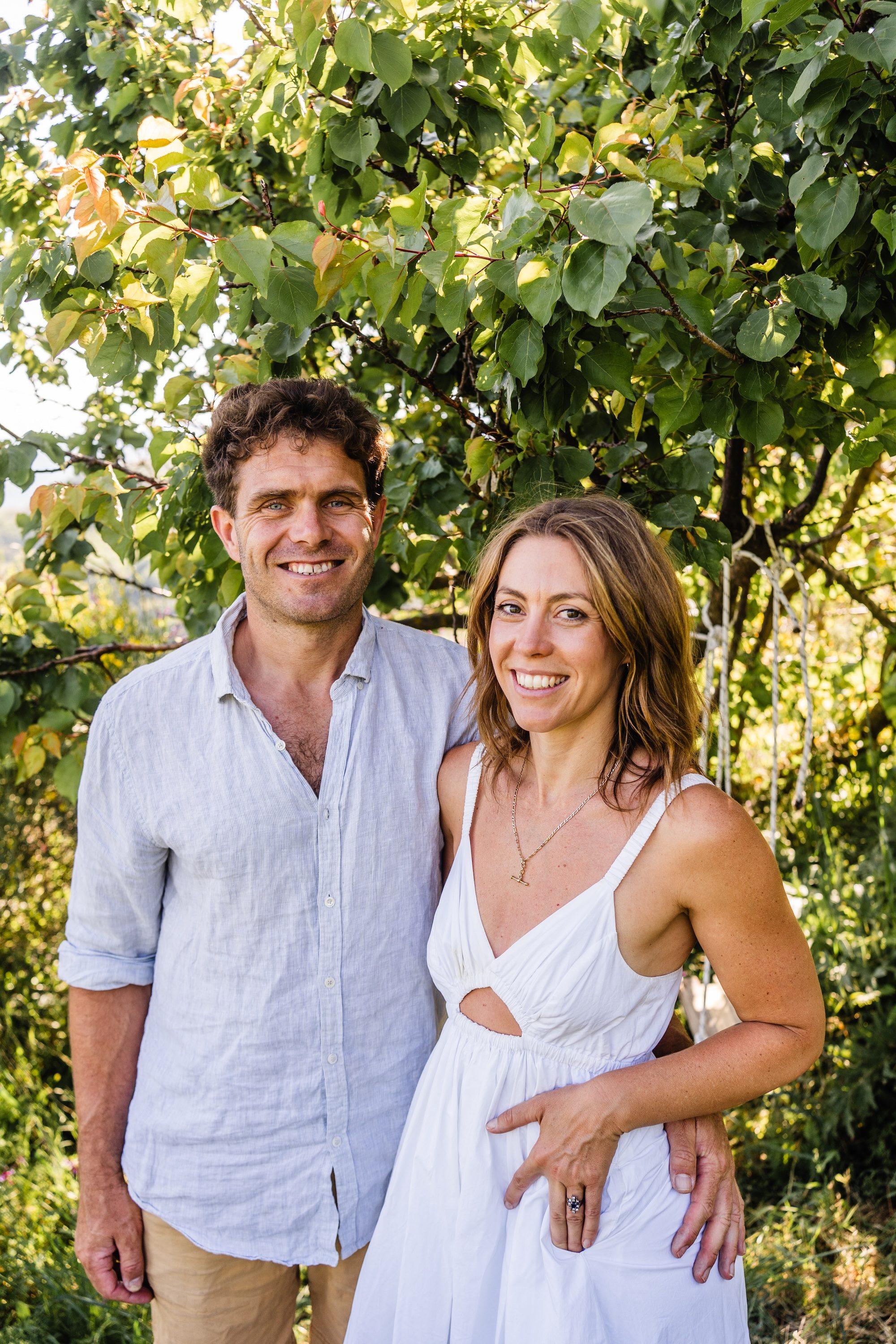 Tyson and Emma of Kairos Wines beneath an apricot tree at their vineyard in the Kedros mountains, Crete